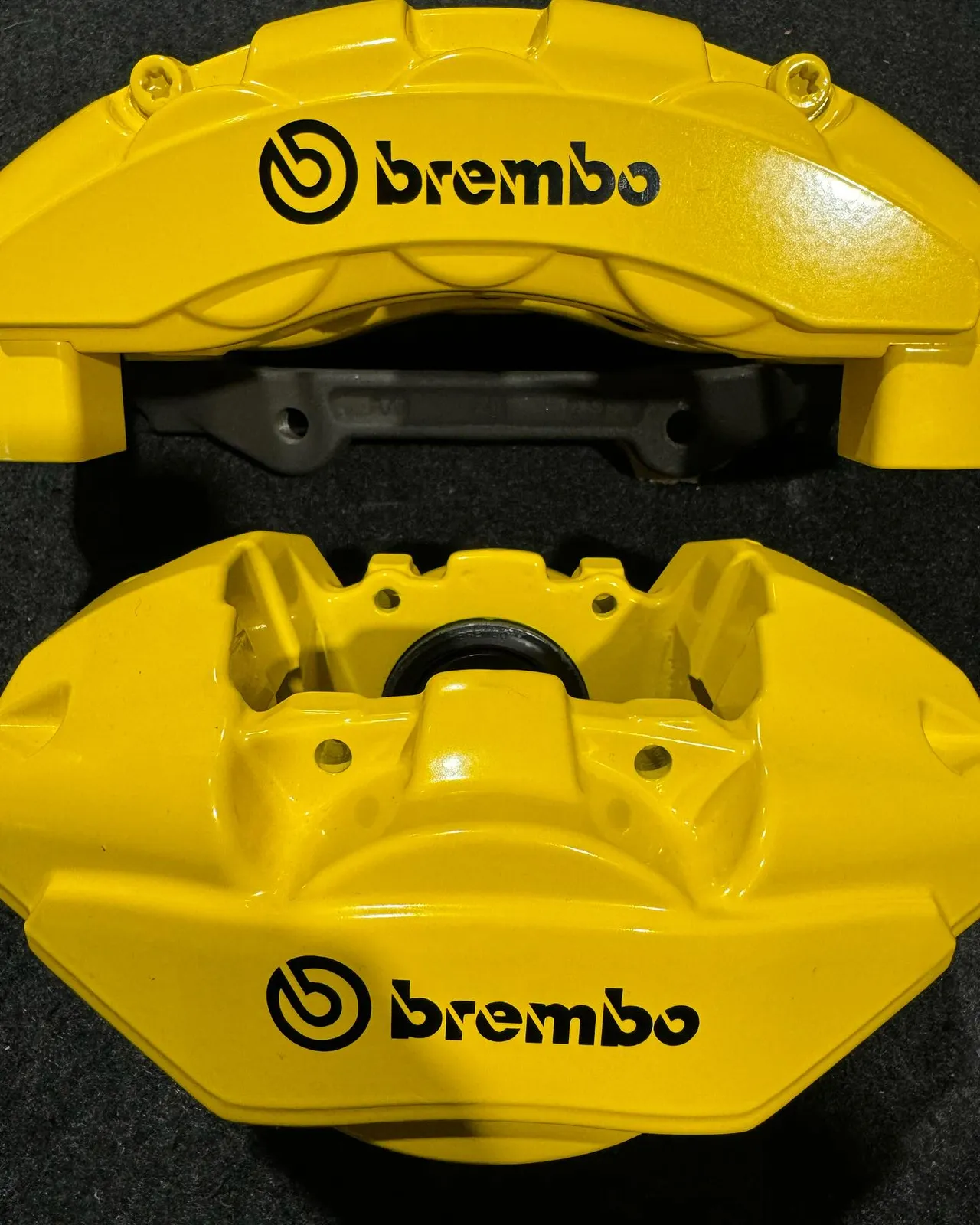 Close-up of two yellow Brembo calipers showing the black logo